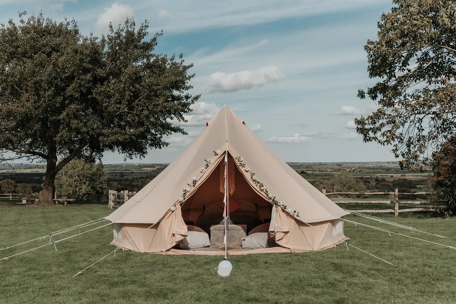 A furnished 5-metre bell tent pitched on the festival field.